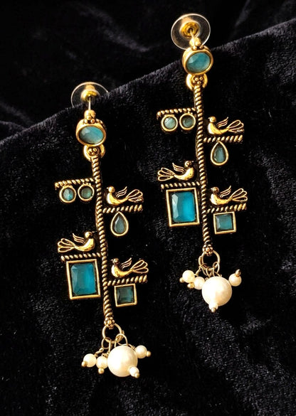 Gold toned oxidized earring with bird motif and aqua blue stone accents 