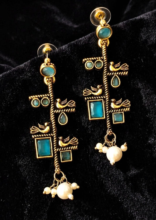 Gold toned oxidized earring with bird motif and aqua blue stone accents 