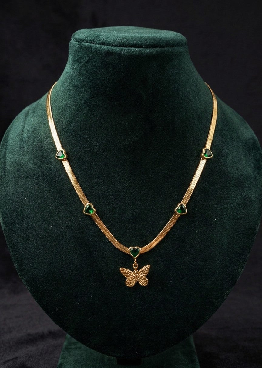 Anti tarnish golden necklace with butterfly pendant and emerald green heart stones.