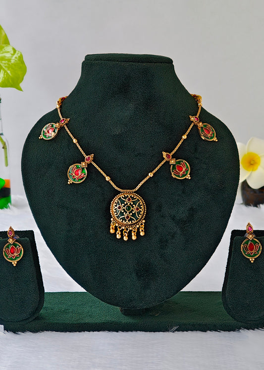 Antique style necklace set with green enamel pendant and red lotus engraved in green enamel accents. Pairing earring of the same accent