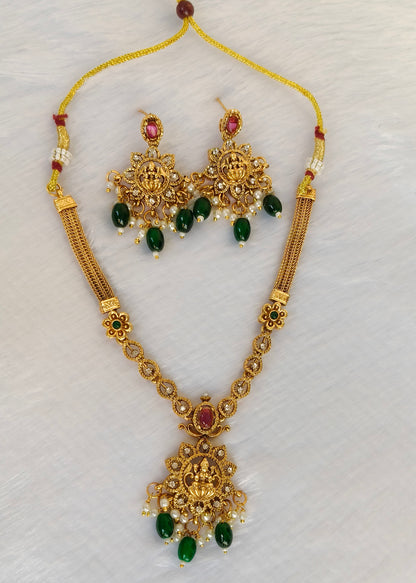 Vidya gold-plated Lakshmi temple necklace and matching earrings with red stones, green drops and pearl clusters.