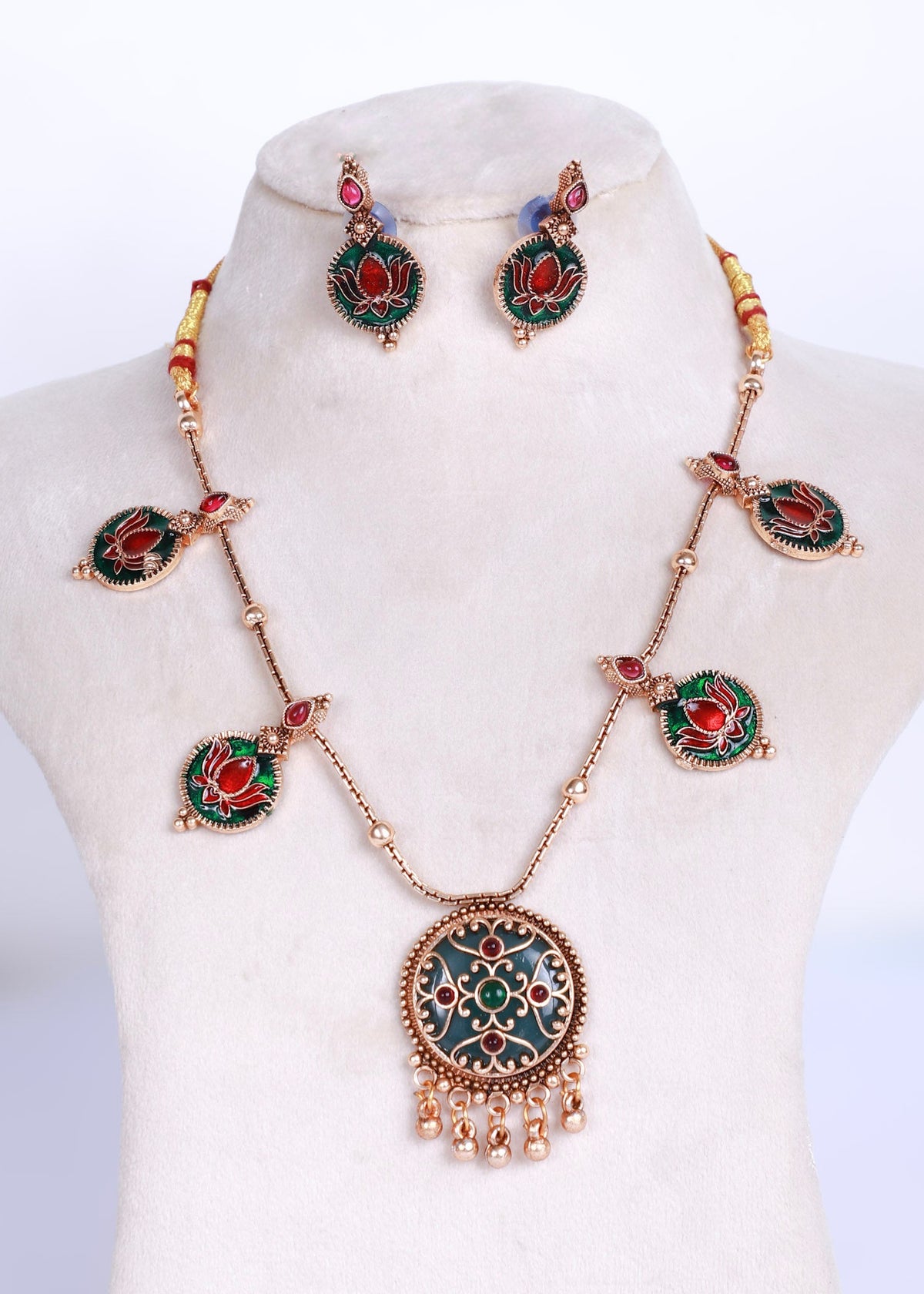 Antique style necklace set with green enamel pendant and red lotus engraved in green enamel accents. Pairing earring of the same accent