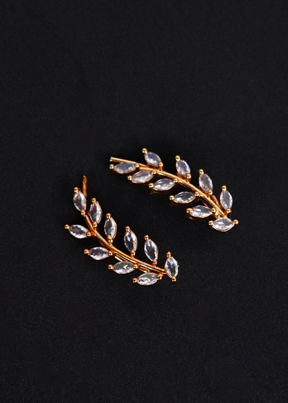 A pair of gold-toned leaf-shaped earrings with marquise-cut clear rhinestones.