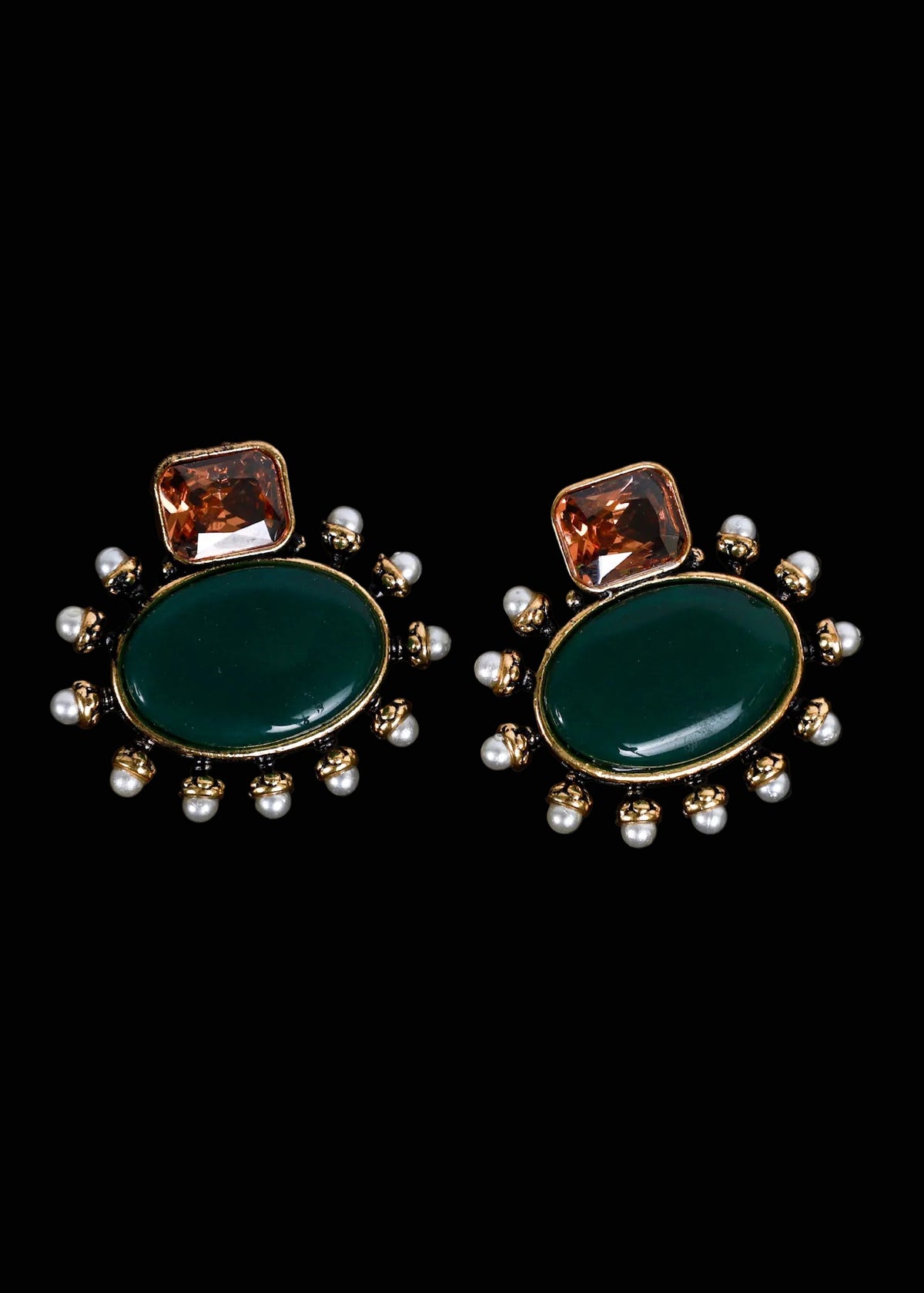 A pair of gold-tone statement earrings featuring a large oval dark green stone, a smaller square amber-brown stone above it, and a border of small white pearls, 