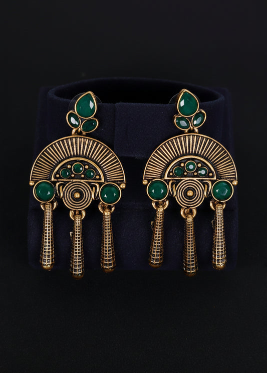 A pair of gold-toned statement earrings with green stone accents, 