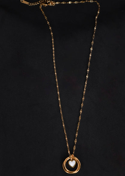 Afreen gold-toned heart and ring necklace on a black background, showing the textured chain and extension clasp.