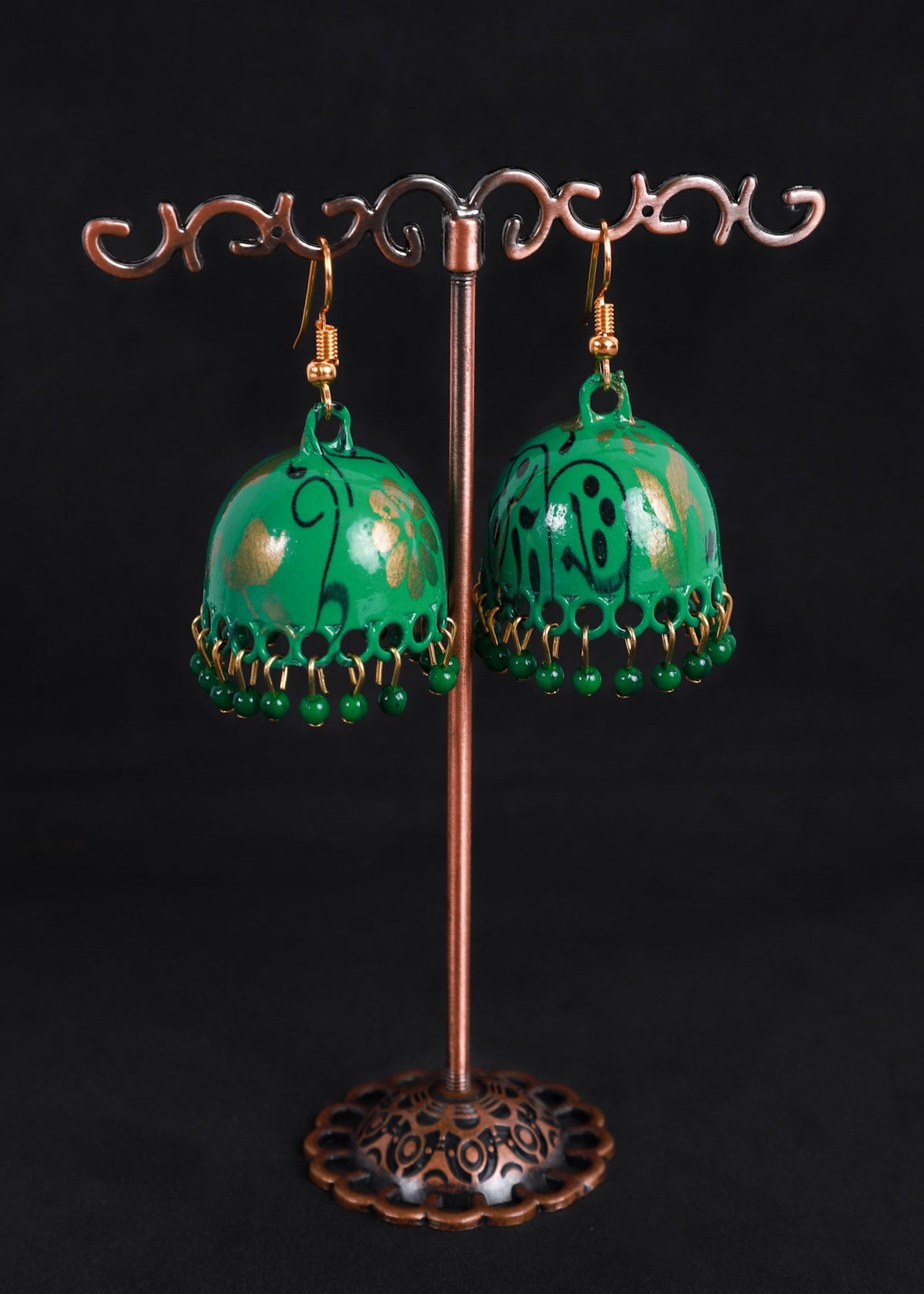 A pair of green Moroccan-style dangle earrings with gold filigree details and green bead fringe, 