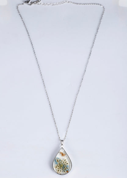 Anti tarnish silver teardrop pendant necklace featuring a preserved butterfly and dandelion inside, displayed on a white background.